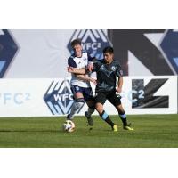 Whitecaps FC 2'S Eliot Goldthorp battles Tacoma Defiance's Kalani Kossa-Rienzi